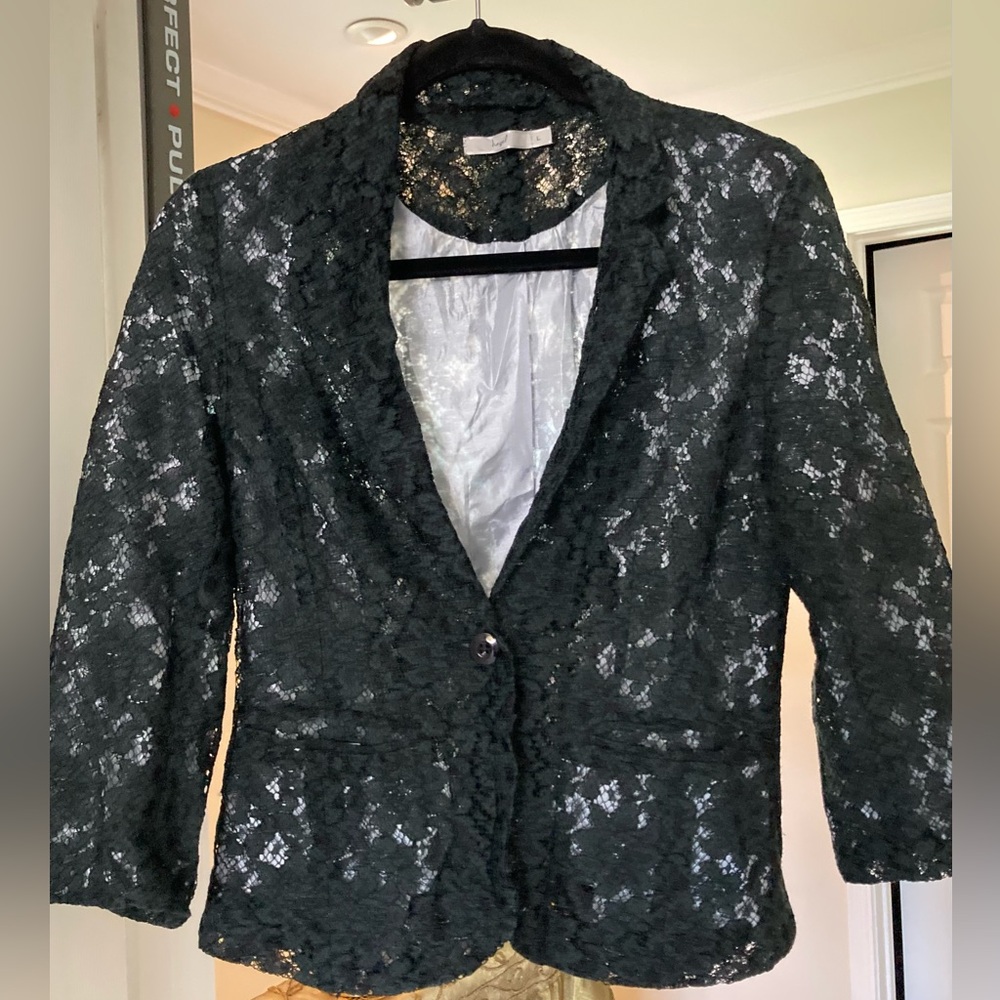 Black lace lined blazer. Says large but I’m an xs/s and it fits me! Runs small!